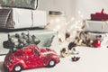 Modern christmas ornaments and car toy with tree, presents cones Royalty Free Stock Photo