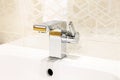 Modern chrome faucet in bathroom Royalty Free Stock Photo