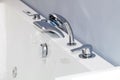 Modern chrome faucet in bathroom Royalty Free Stock Photo