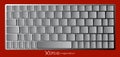 Modern chrome laptop bluetooth keyboard isolated on red background Royalty Free Stock Photo