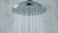 Modern Chrome Shower Head with Running Water Royalty Free Stock Photo