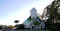 Modern Church at sunrise place of worship in natural setting and blue sky backing Royalty Free Stock Photo