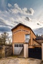 Modern cinema in garage, old building in medieval village, contrast Royalty Free Stock Photo