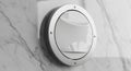 Modern Circular Smart Device on Marble Wall Royalty Free Stock Photo