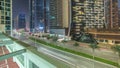 Modern city architecture in Business bay district. Panoramic view of Dubai's skyscrapers night timelapse Royalty Free Stock Photo