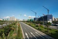 Modern city with highway traffic and building under construction. Hanoi city, Thang Long highway Royalty Free Stock Photo