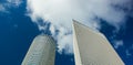 Modern city landmark photography of three high glass skyscrapers from below perspective foreshortening on blue sky background with Royalty Free Stock Photo