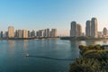 Modern city skyline of residential district with water foreground at dusk Royalty Free Stock Photo