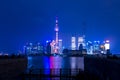 Modern city skyscrapers of Shanghai skyline at night with reflection of beautiful ligth in Huangpu river view from Royalty Free Stock Photo