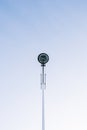 Modern city street lamp in the center of the photograph with the blue sky clear in the background Royalty Free Stock Photo