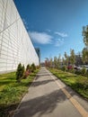 Modern Cityscape with Geometric Facade and Landscaped Walkway Royalty Free Stock Photo