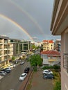 Modern cityscape and rainbow view. wide angle.