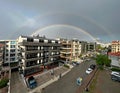 Modern cityscape and rainbow view. wide angle