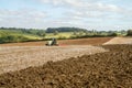 Modern claas tractor cultivating field Royalty Free Stock Photo