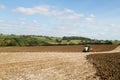 Modern claas tractor cultivating field Royalty Free Stock Photo