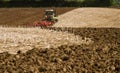 Modern claas tractor cultivating field