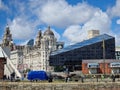 Modern and classic architecture and strolling people at the Liverpool Docks, Port of Liverpool