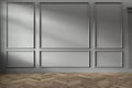 Modern classic gray empty interior with wall panels and wooden floor.