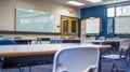 Modern Classroom Interior with Whiteboard, Desks, and Chairs in Bright Educational Setting Royalty Free Stock Photo