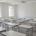 A modern classroom with multiple rows of neatly arranged white desks and matching