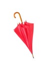 Modern closed red umbrella isolated on