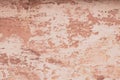 Modern closeup on soft pink backdrop. Old dirty wall texture. Grunge pink texture. Pastel paint texture background. Cracked paint Royalty Free Stock Photo