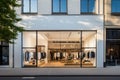 Modern clothing boutique with glass facade, city street view.