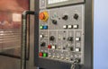 Modern CNC machining center with control panel on foreground. Close up view. Selective focus. Royalty Free Stock Photo