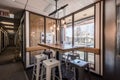 modern co working space with blackboard, desk, brown and black chair,brown table cozy loft office interior