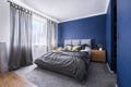 Cobalt blue bedroom with bed