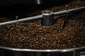 Modern coffee roaster machine with beans, closeup Royalty Free Stock Photo