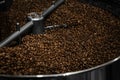 Modern coffee roaster machine with beans, closeup Royalty Free Stock Photo
