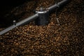 Modern coffee roaster machine with beans, closeup Royalty Free Stock Photo
