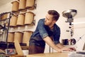 Modern coffee roastery with the owner working on his laptop Royalty Free Stock Photo