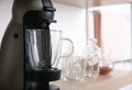 Modern coffeemaker with glass cup on shelf, closeup Royalty Free Stock Photo