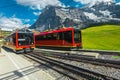 Modern cogwheel tourist trains waiting in the train station, Grindelwald, Switzerland