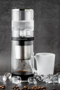 Modern Cold brew drip tower coffee maker on dark stone background Royalty Free Stock Photo