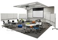 Modern collaborative learning space with movable whiteboards and projector screen Royalty Free Stock Photo