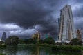 Modern Colombo skyline reflected in a lakeside view under dramatic storm clouds Royalty Free Stock Photo
