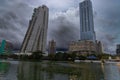 Modern Colombo skyline reflected in a lakeside view under dramatic storm clouds Royalty Free Stock Photo