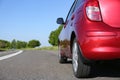 Modern color family car on highway, closeup