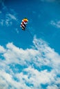 Modern and colorful kite flying in blue sky Royalty Free Stock Photo