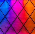 Modern and colorful lights in the colors blue,purple, pink, red and orange. Diamond pattern, Neon light background Royalty Free Stock Photo