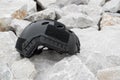 Modern combat helmet on ground. Royalty Free Stock Photo