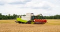 Combine harvester prepare to unload seeds in truck Royalty Free Stock Photo