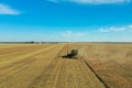 Modern combine harvester working in field. Agriculture industry