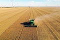 Modern combine harvester working in field. Agriculture industry