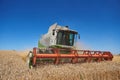 A modern combine harvester working a wheat field Royalty Free Stock Photo