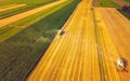 A modern combine harvester working a wheat field, aerial view Royalty Free Stock Photo