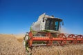 A modern combine harvester working a wheat field Royalty Free Stock Photo